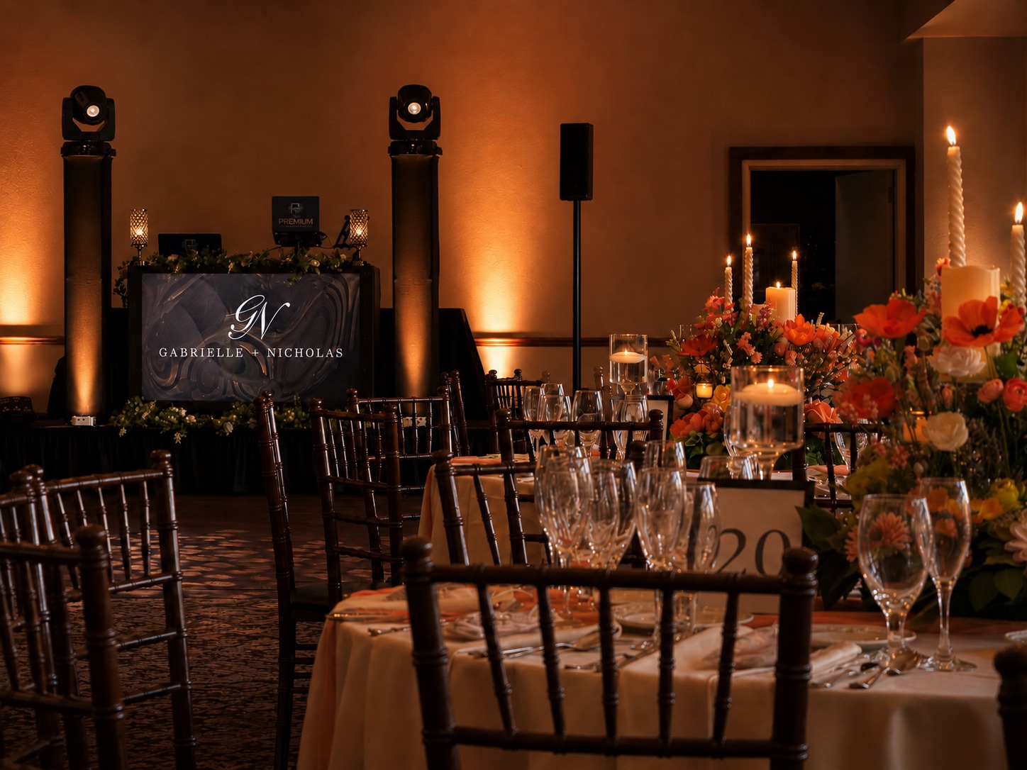 Premium Entertainment DJ setup at Terraview — monogram backdrop, uplighting, and Gabrielle + Nicholas personalized screen