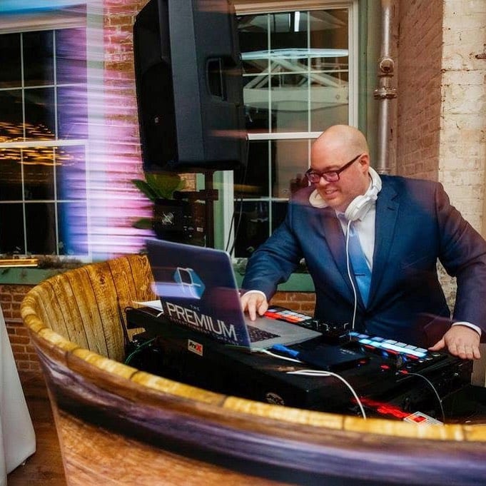 Anthony DeStefano at the Premium Entertainment wood DJ booth