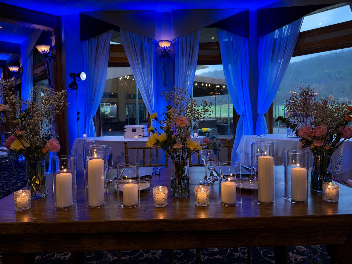 Black Bear Golf Club reception with deep blue uplighting washing the walls