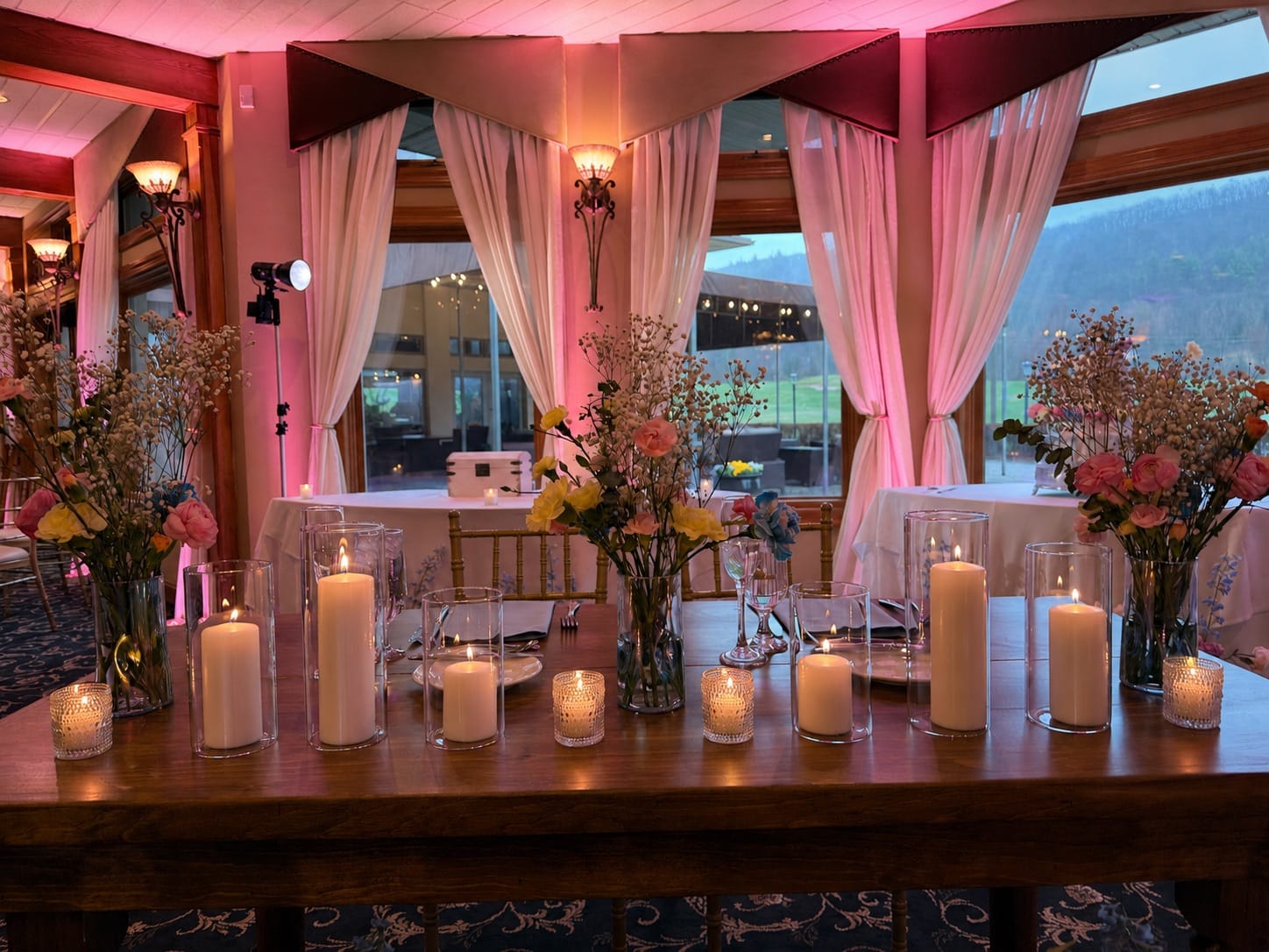 Black Bear Golf Club reception with rich pink uplighting setting the dance-floor mood
