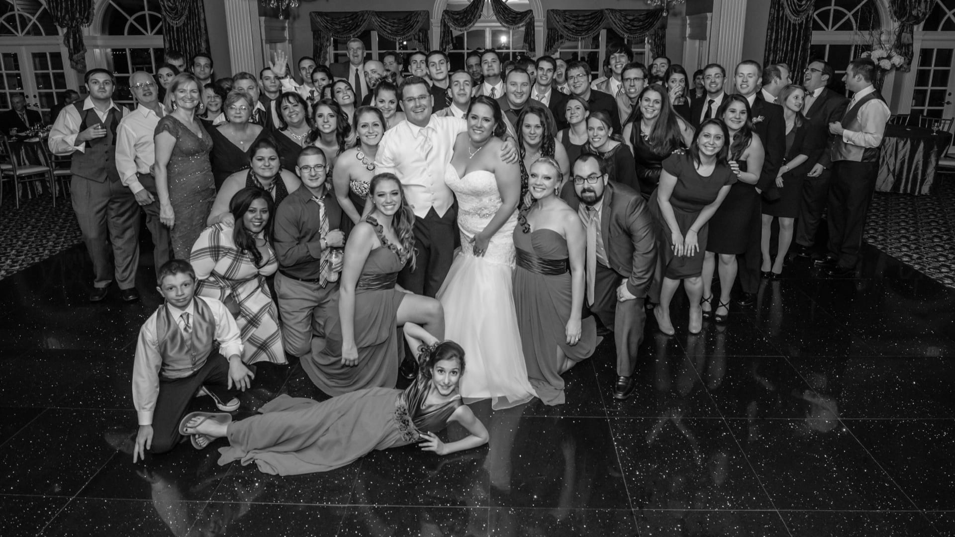 Wedding guests celebrating on the dance floor at Fallkirk Estate