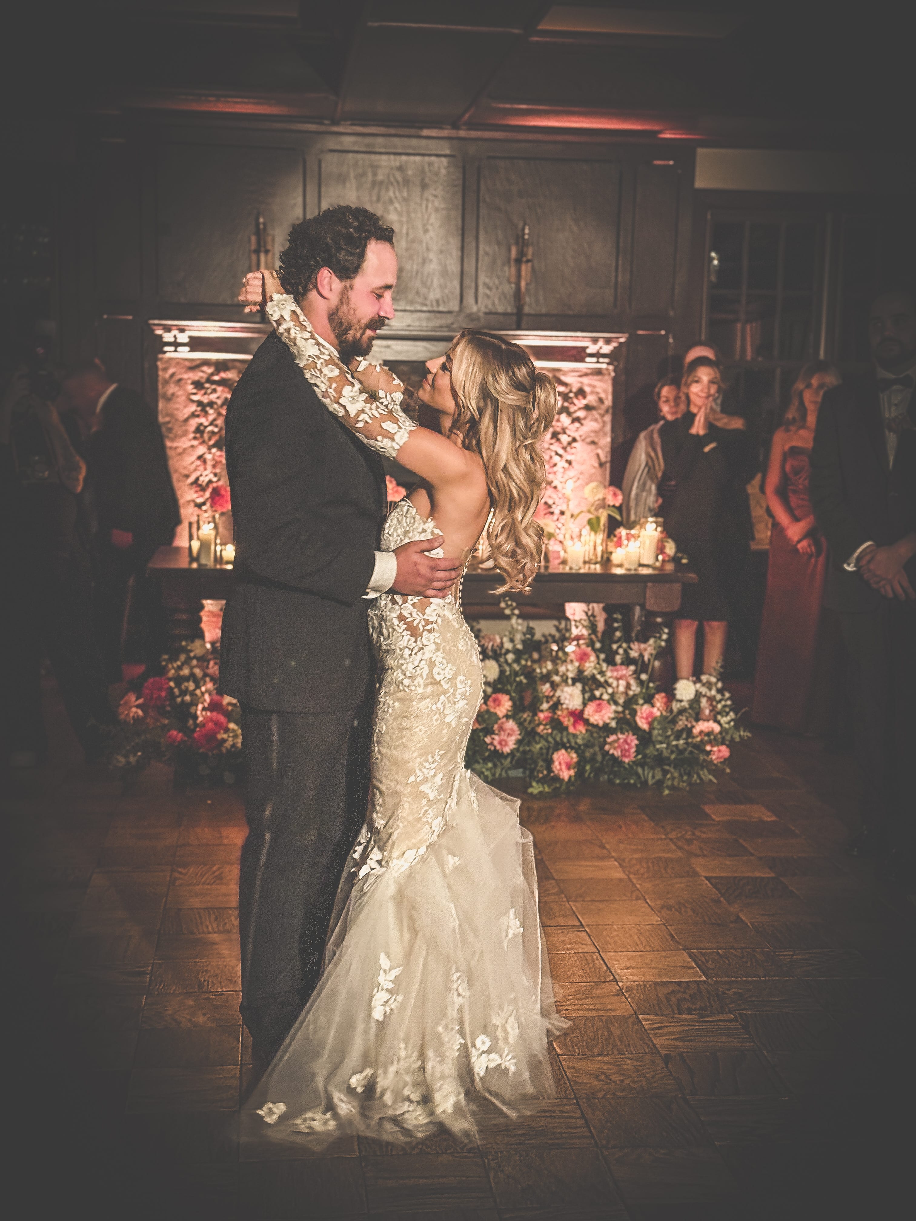 Bride and groom share a romantic moment in the Colt Ballroom at Hotel du Village