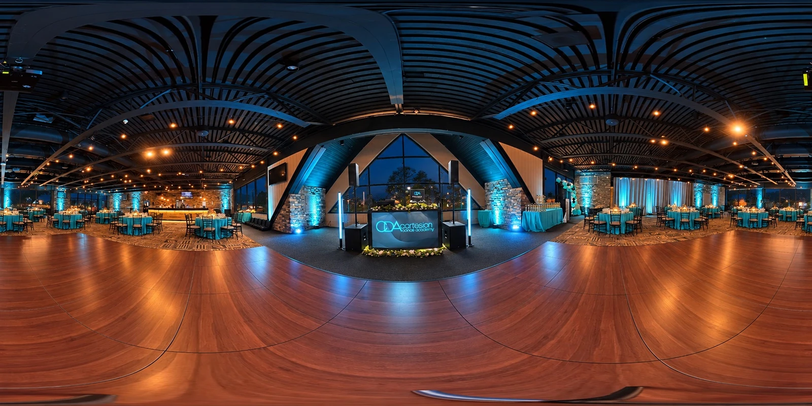 Blue Mountain Resort wedding reception ballroom with blue uplighting, photographed in the evening