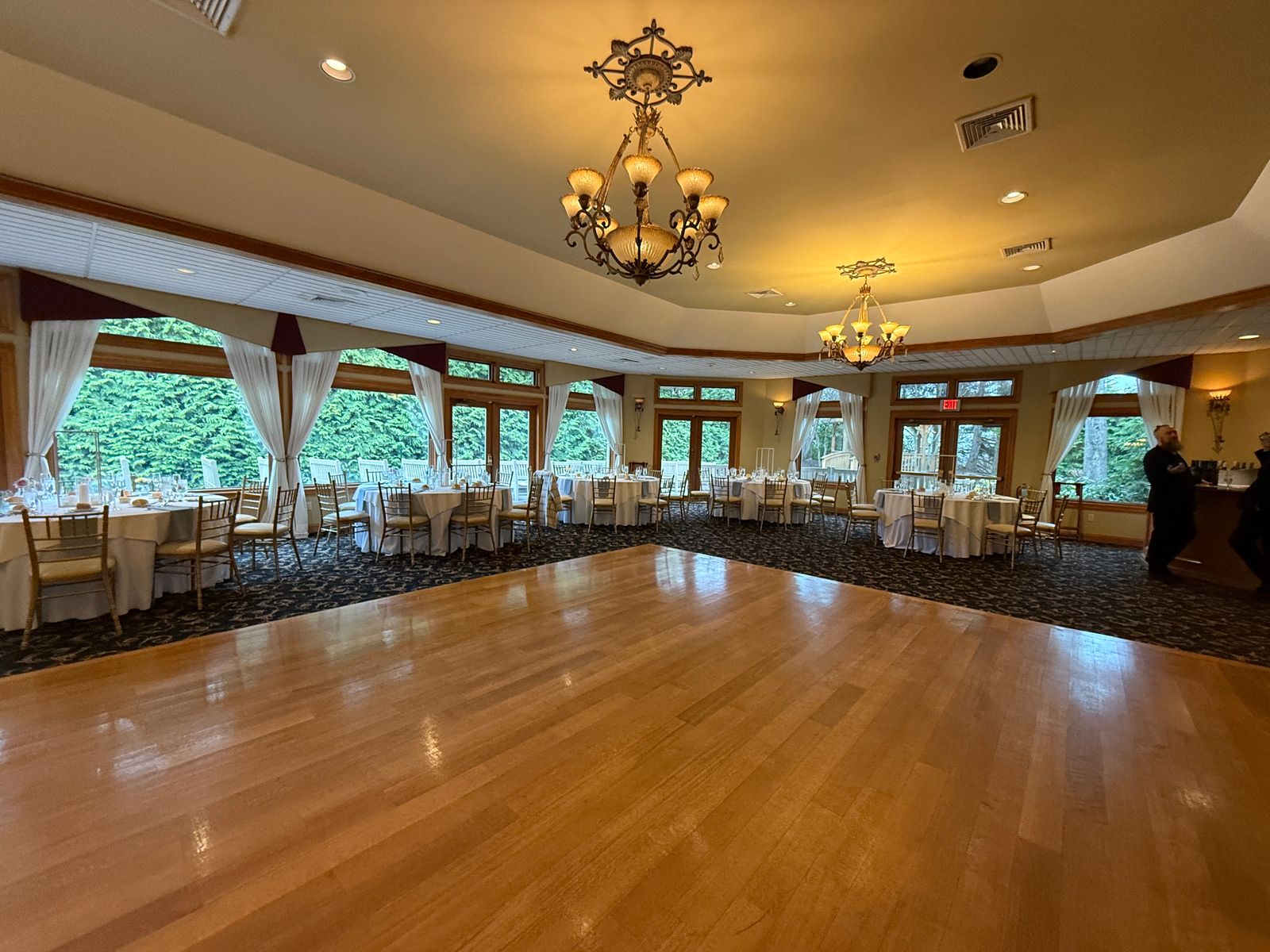 Black Bear Golf Club reception room before uplighting — lit only by ambient room light