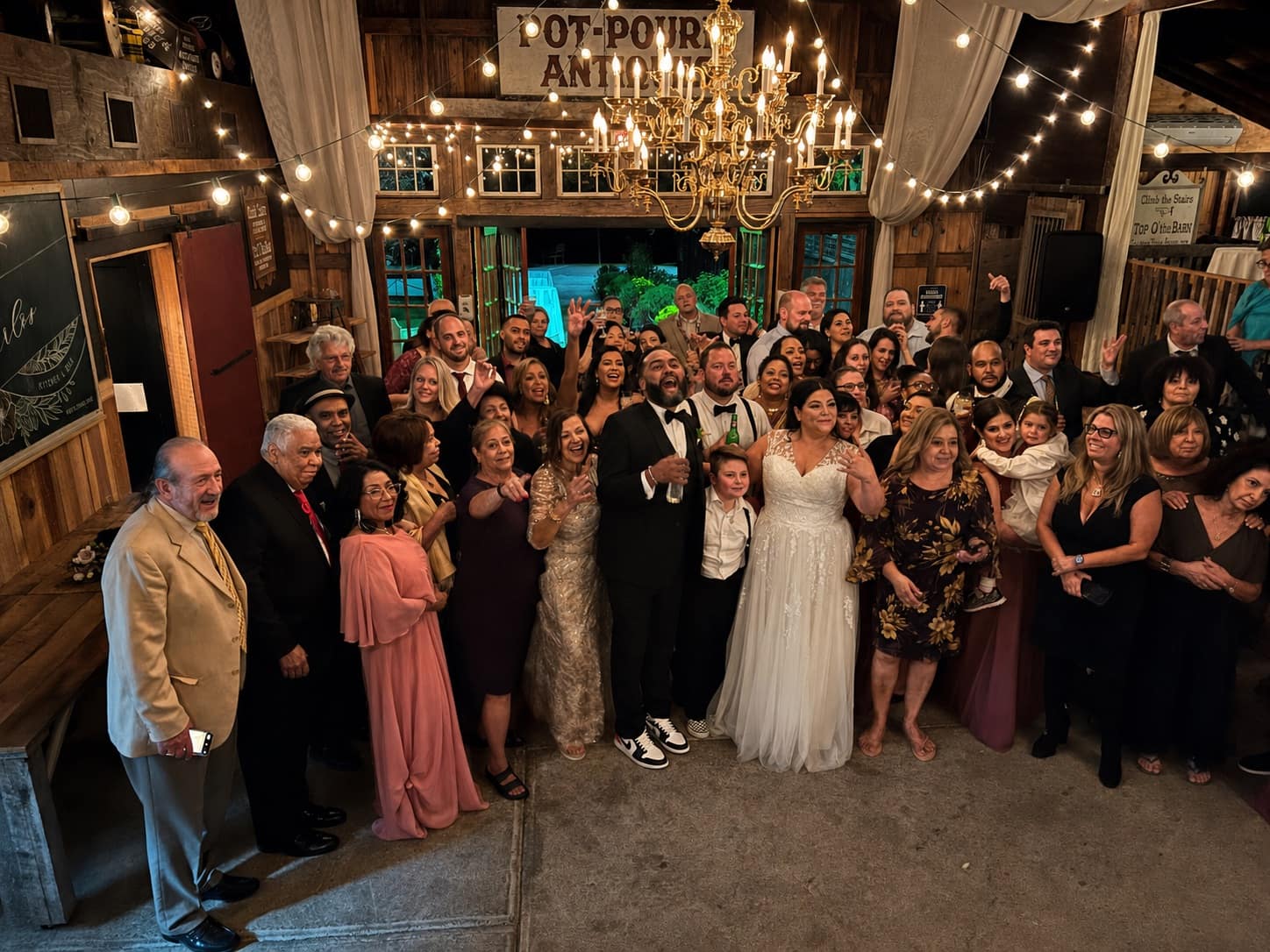 Wedding group photo during the reception at Jack's Barn in Oxford, NJ