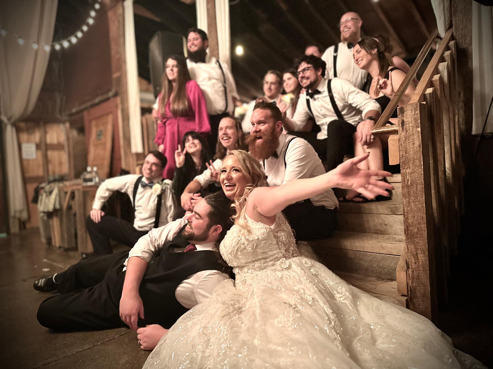 Wedding reception dancing inside the warmly lit loft at The Loft at Jack's Barn