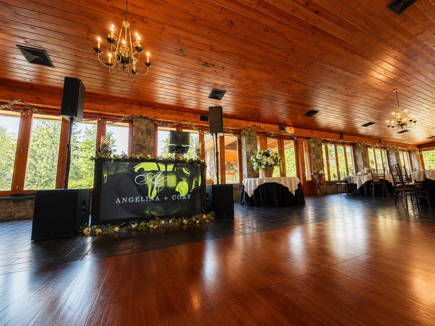Lawnhaven at Stroudsmoor by Wedgewood Weddings — Angelina + Cory DJ booth view with sweetheart table and pavilion windows before uplighting