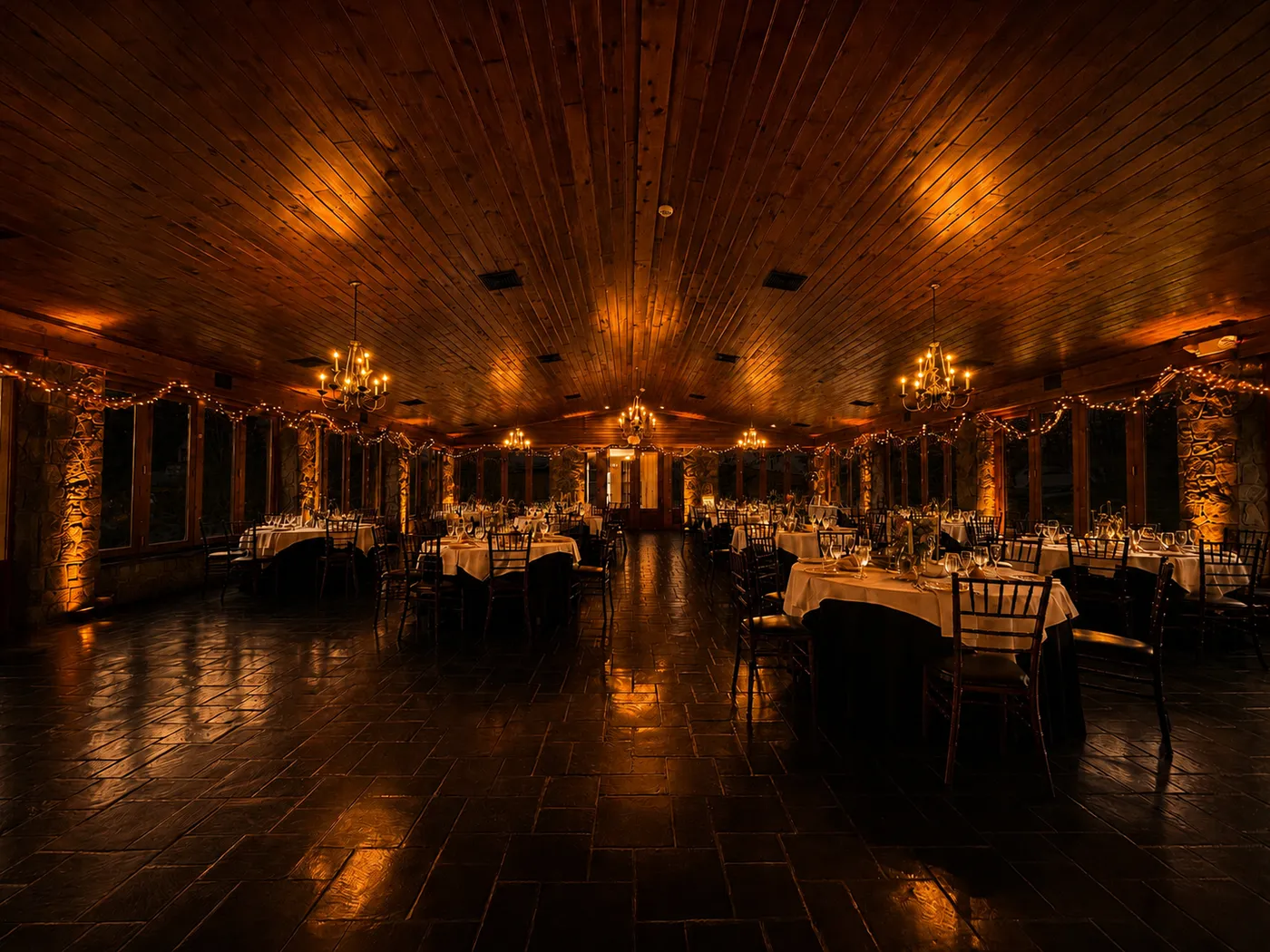 Stroudsmoor by Wedgewood Weddings — warm-lit reception hall with chandeliers