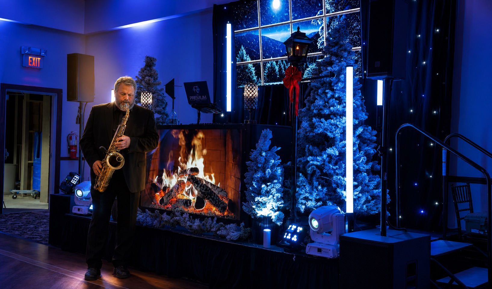 Christmas holiday party at Terraview, Stroudsmoor by Wedgewood Weddings — live saxophonist with winter-themed décor, snowy window backdrop and flocked trees